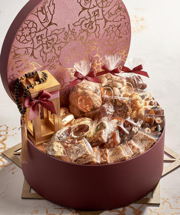 Round Box with Golden Finishing Contains 36 pieces ( Yamish - Nuts - Belgian Chocolate meshmesh - Turkish Delights - Belgian Chocolate Yamish Mendiants - Qamar elDeen - Lantern and Sebha )