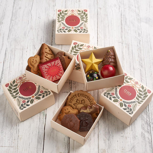 4 Piece (1wrapped Belgian chocolate bonbon 2 mini gingerbread cookies 1 Belgian chocolate cookie)